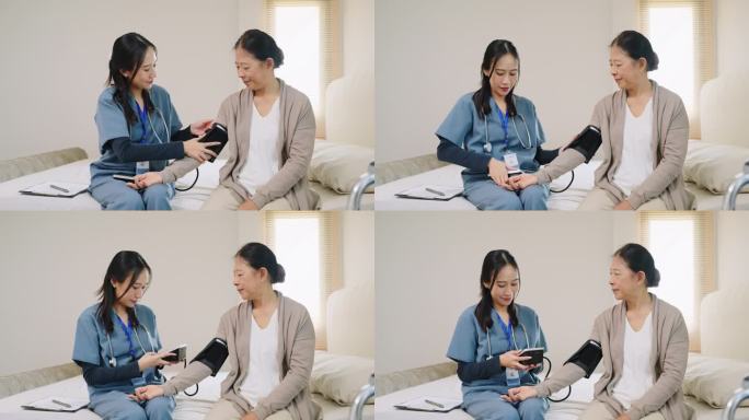 穿着蓝色工作服的亚洲护理护士给坐在卧室床上的老年妇女检查血压监测仪和带数字压力表的心率监测仪，医疗保