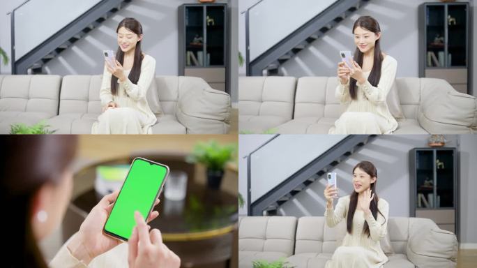女子坐在沙发上玩手机视频通话