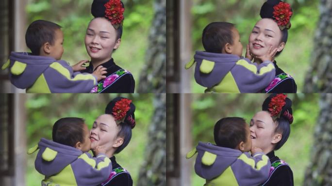 苗族妈妈抱着小孩的幸福