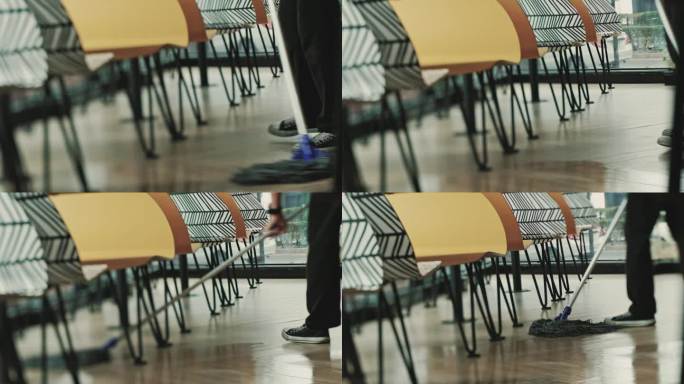 一个人在小商店里打扫地板