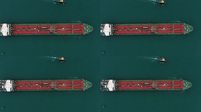 一艘巨大的货轮漂洋过海驶向港口。海运、货运、内河、海运。