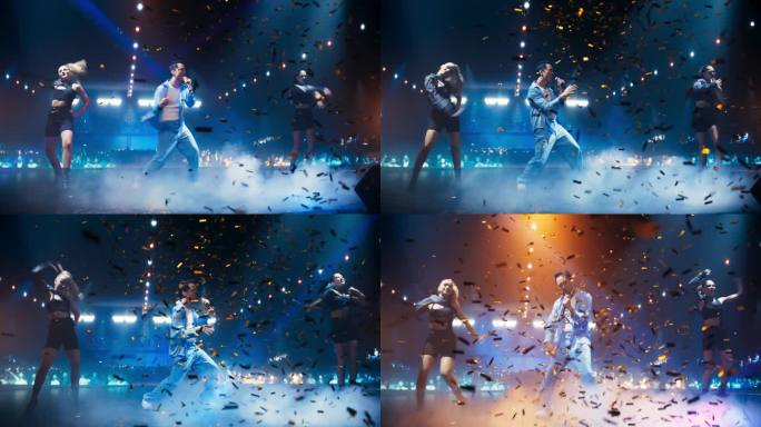 年轻的韩国流行歌手穿着时髦的蓝色服装，在五彩纸屑环绕的节日舞台上与歌舞女郎一起演出。在拥挤的舞台上，