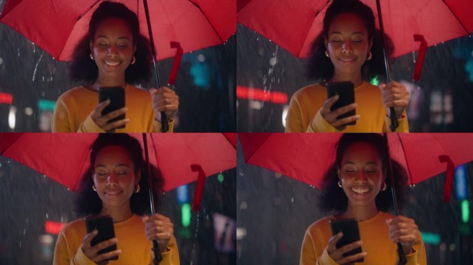 黑色时尚女性在雨中打着红色雨伞使用智能手机，在社交媒体上与用户互动。一个女孩在夜晚的街道上看着相机微