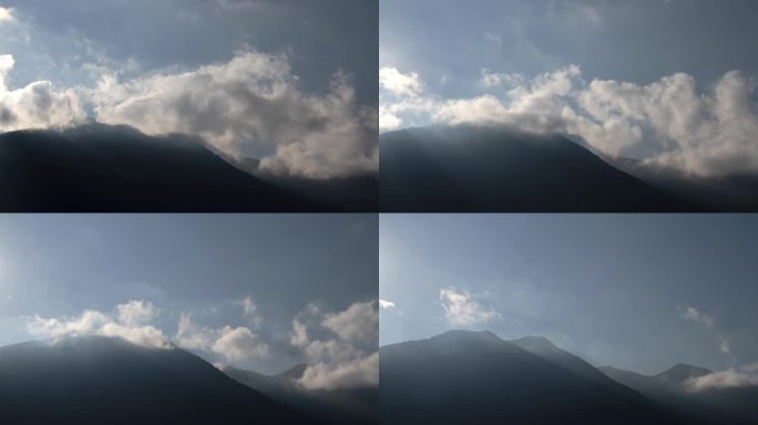 在意大利科莫湖的山峰上，云层在晨光中消散。