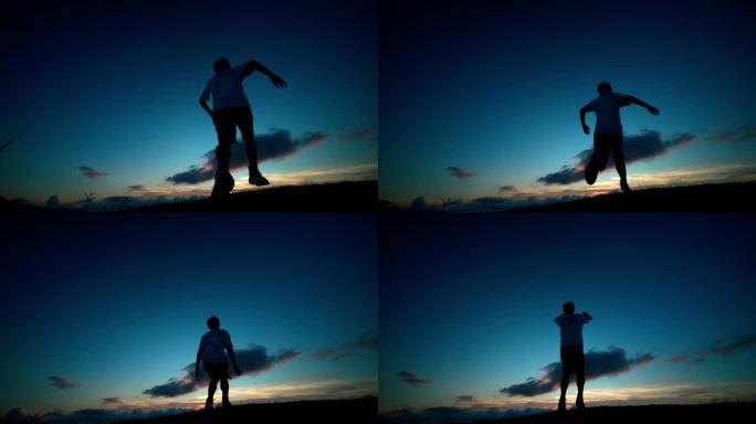 年轻人冲上山顶欢呼呐喊跳跃