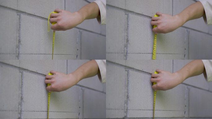 4K工程工地卷尺量墙面特写