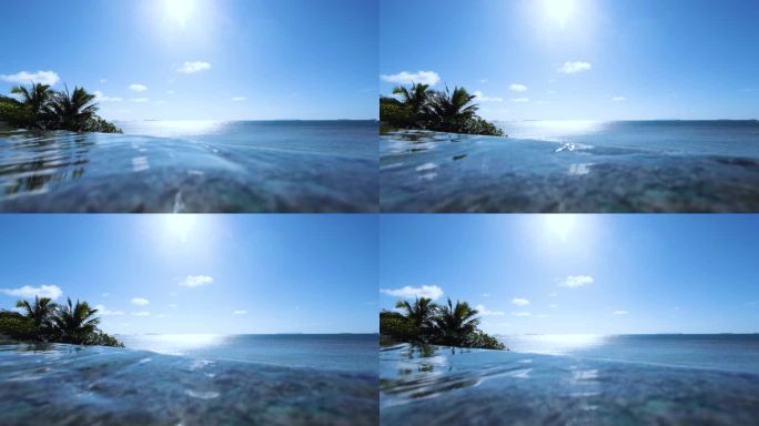 蓝天白云阳光下海边无边界游泳池