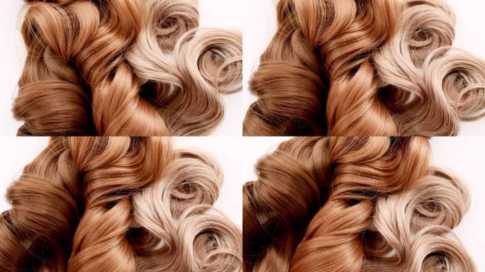 一绺棕色的卷发。闪亮的女人发束，卷发。护发美容美发。天然化妆品。发色调色板。