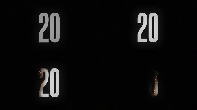 数字20在黑色背景上燃烧并变成灰烬