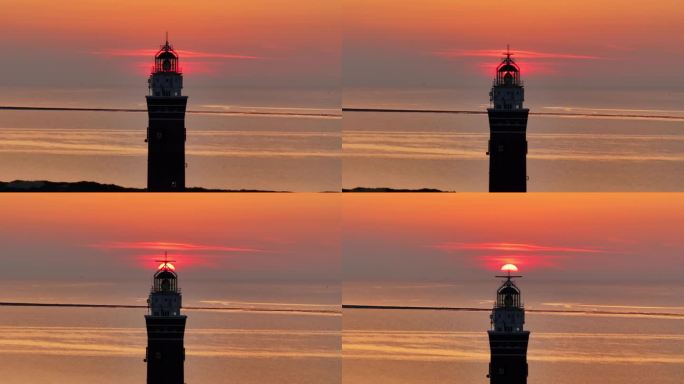 荷兰奥德多普海岸日落时的灯塔鸟瞰图。
