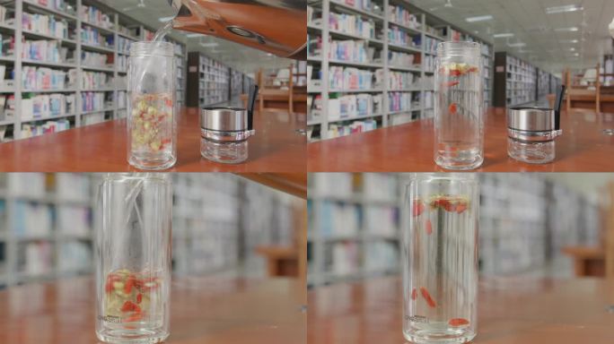 在图书馆冲泡枸杞菊花茶  保温杯里泡枸杞