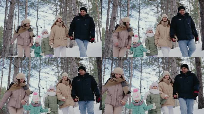 欢乐的一家人在雪林中享受冬日漫步