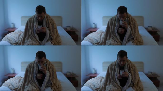 夜间病发烧的人在卧室休息，服用药片