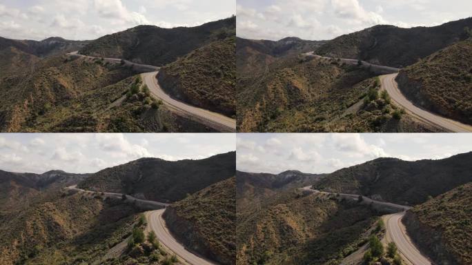 汽车行驶在有风的山路上