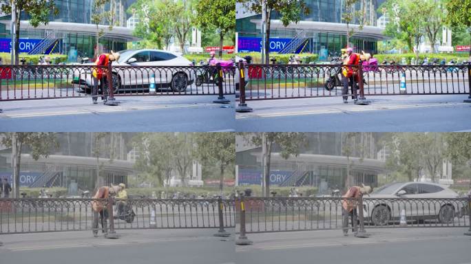 工人修理道路分道杆