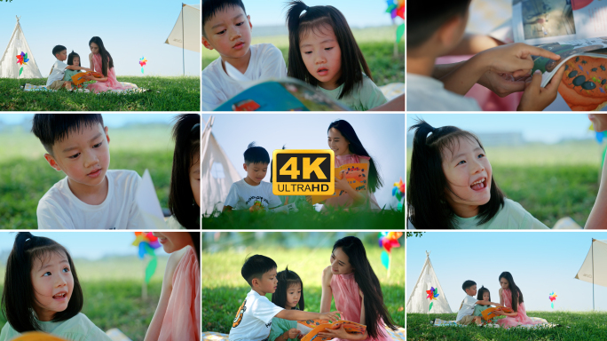 草地上妈妈带孩子看书公园休闲周末娱乐