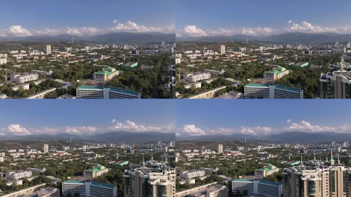 从哈萨克斯坦城市阿拉木图中部的一架四轴飞行器上看到的一个夏天的晚上