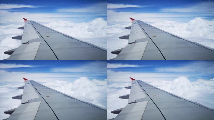 在飞机机翼的飞行过程中，从乘客窗口望去，天空中聚集着暴雨前的灰云。