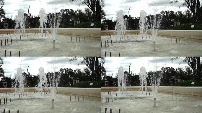 公园里一个简单的活动喷泉，用慢动作溅起水花。