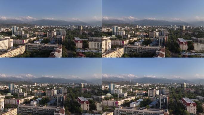 从哈萨克斯坦城市阿拉木图中部的一架四轴飞行器上看到的一个夏天的晚上