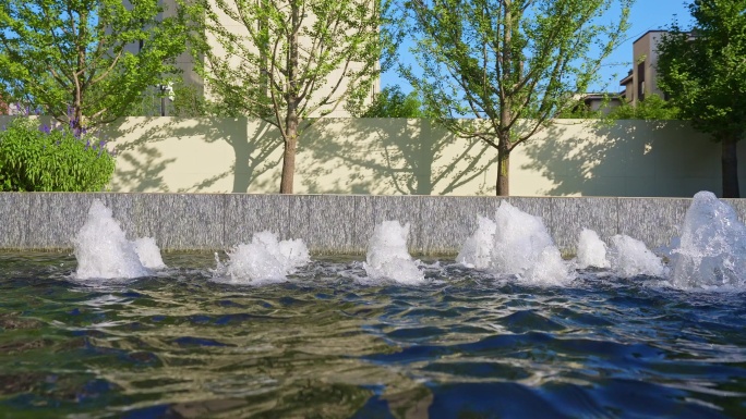 中国居民楼住宅小区春夏季喷泉水系景观空镜