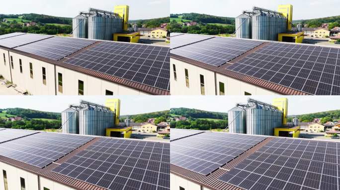 现代农场鸟瞰图，有筒仓和太阳能电池板装置