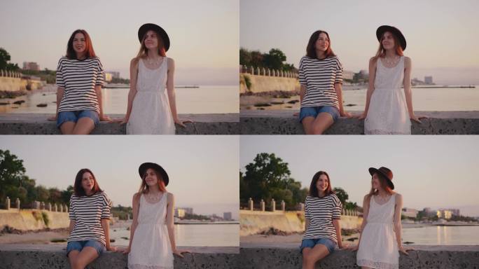 一个美丽的场景，两个朋友在宁静的海岸线上真正享受迷人的日落，捕捉到一个完美的时刻，在彼此的陪伴下，幸