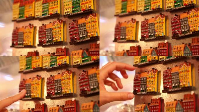 游客在哥本哈根商店选购纪念品冰箱贴