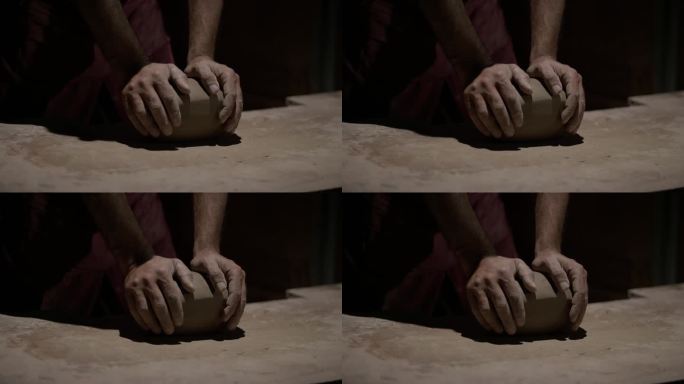 陶工大师的双手，在陶工转盘上工作，制作盘子