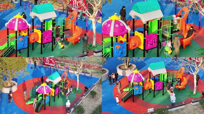 孩子在小区里的游乐场滑滑梯