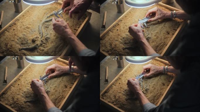 考古学家与同事测量恐龙遗骸