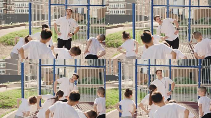 孩子们在体育课上和老师一起在户外做运动。教练示范如何准备户外篮球赛。体育、人、教育理念。