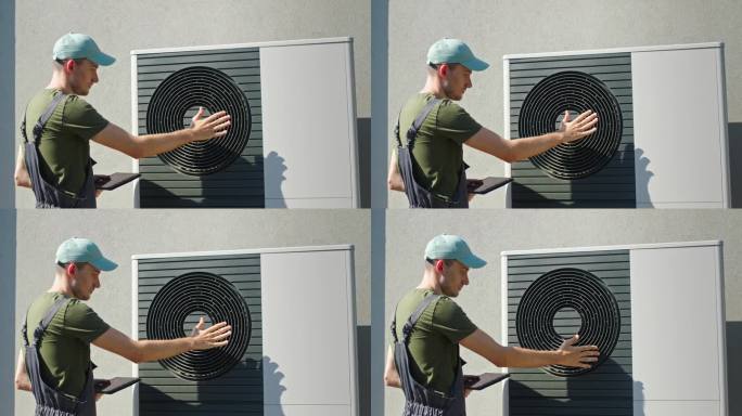 技术员在阳光明媚的日子里在屋外调整热泵机组。