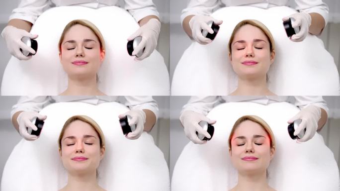 一位女士正在接受LED光疗，这是一种非侵入性的面部治疗，可以恢复活力并增强皮肤纹理。完美展示先进的护