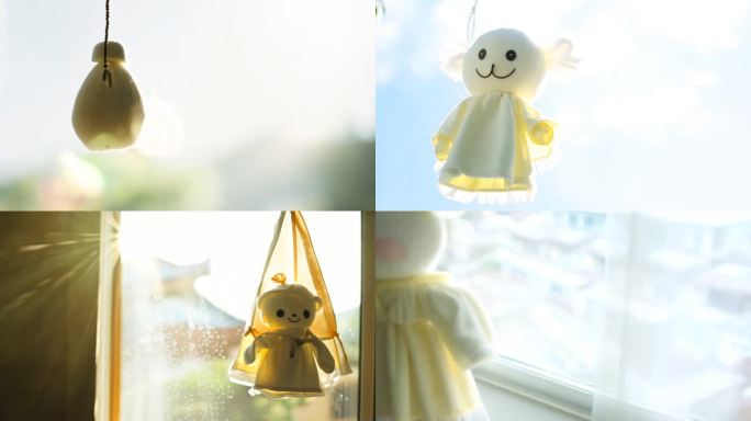 晴天娃娃特写挂在窗前 阳光明媚好心情
