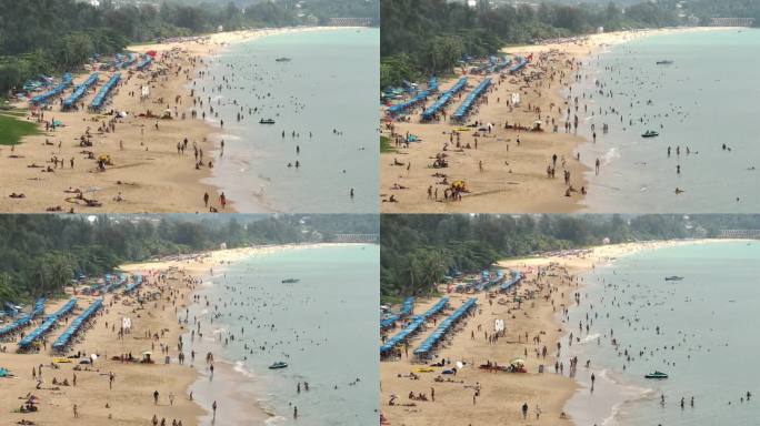 白天普吉岛著名的游客拥挤的卡隆海滩海岸线航拍全景4k泰国