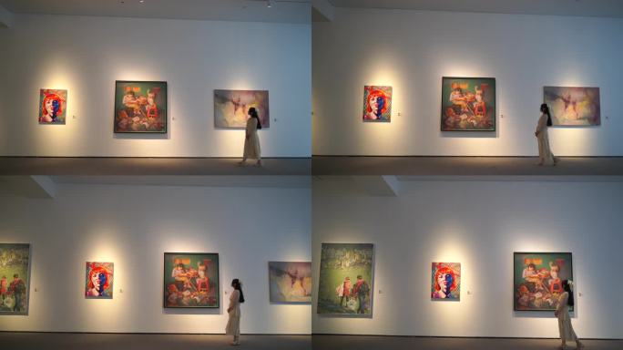 美女参观美术馆看美术作品女人欣赏艺术绘画
