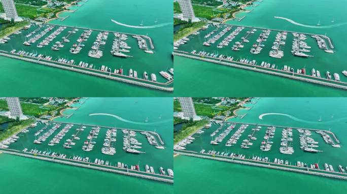 海上，港口，船只和城市建筑的空中无人机视图。度假小镇的壮丽景色，乘坐不同大小的游艇飞越滨海湾