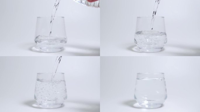 把水倒进白色背景的空杯子里