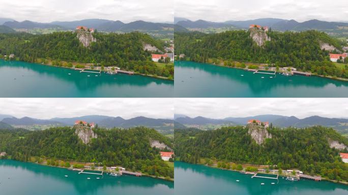 斯洛文尼亚布莱德湖令人惊叹的无人机镜头，展示了标志性的岛屿、城堡和郁郁葱葱的景观。体验惊人的鸟瞰清澈