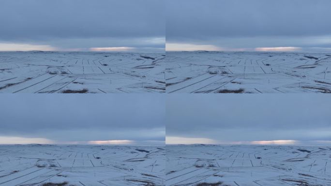 延时航拍浓郁夕阳下的垦区雪原