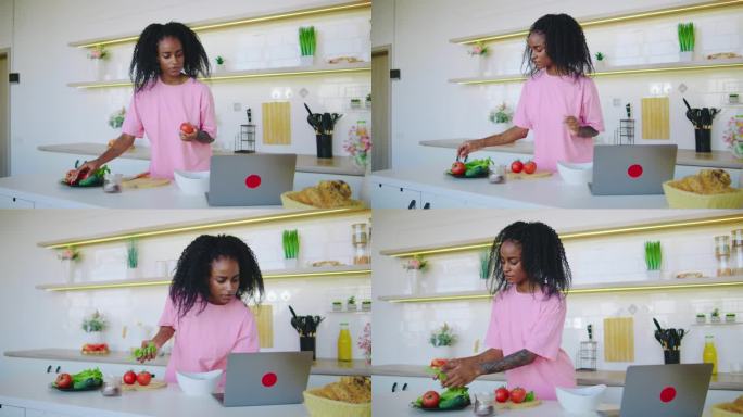 一个女人正在一个非常现代的厨房里积极地准备新鲜的食材，熟练地展示她的烹饪才能，而周围是一系列鲜艳的颜