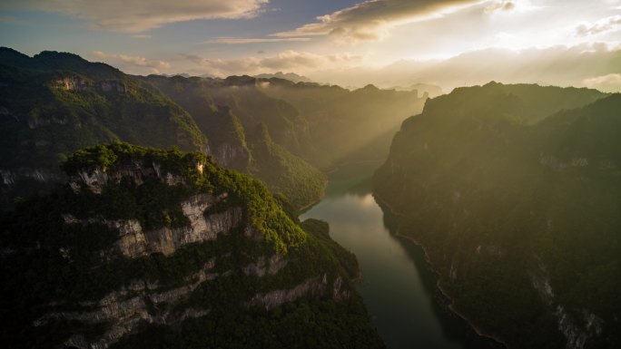 航拍山区陡峭的山峰峡谷日出