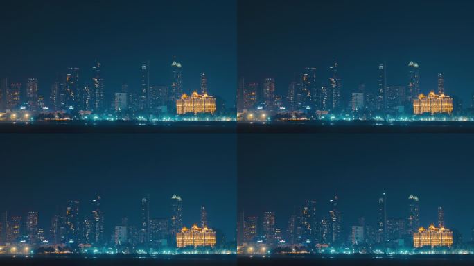 孟买,印度。傍晚城市天际线从海上驾驶延时，延时，延时。孟买后湾海岸。夜光下的摩天大楼和赛菲医院