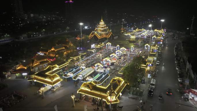 西双版纳勐腊县泼水广场南腊河星光夜市航拍