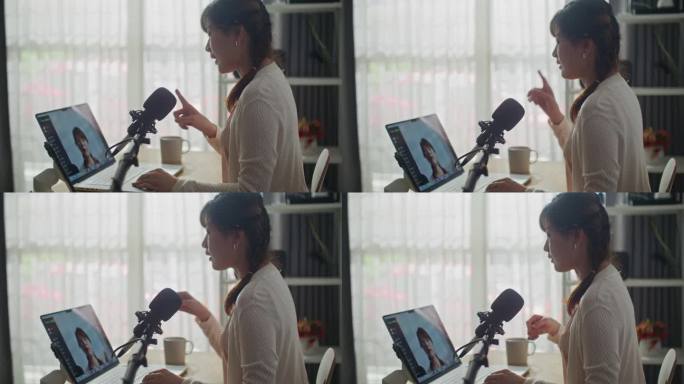 社交媒体上的亚裔女性内容创作者，对着笔记本电脑摄像头说话