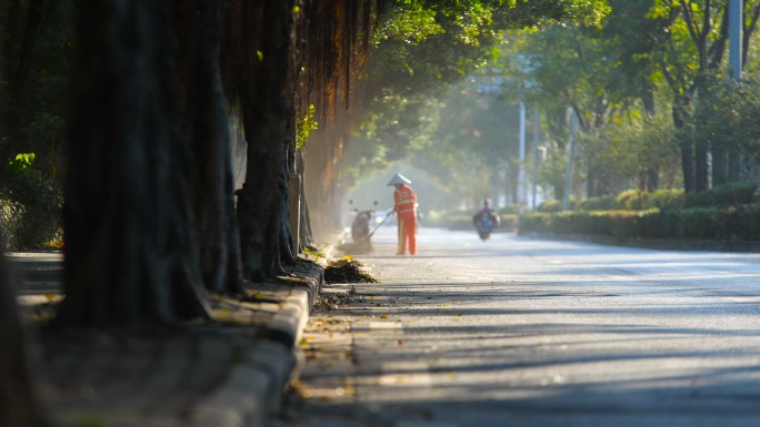 城市环卫工人清扫落叶