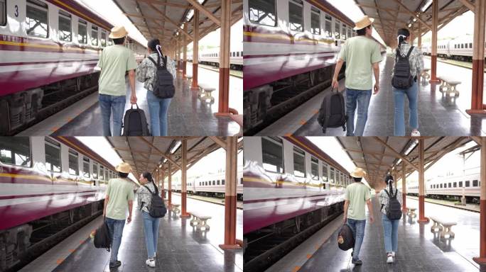 两名男女游客准备乘火车旅游。4K慢动作视频。