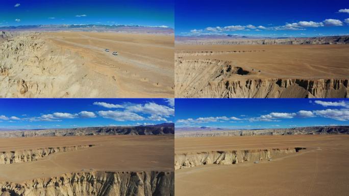 航拍越野车行驶在壮观的札达土林的悬崖边