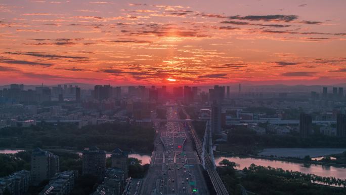 航拍长春卫星桥南部快速路日出朝霞延时